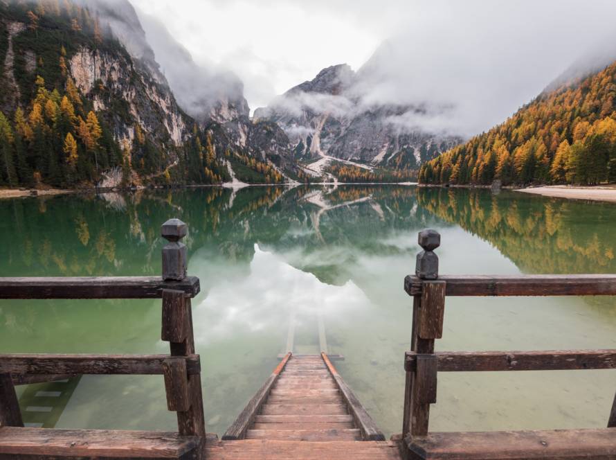 Moody autumn day in the Dolomites forest and mountains